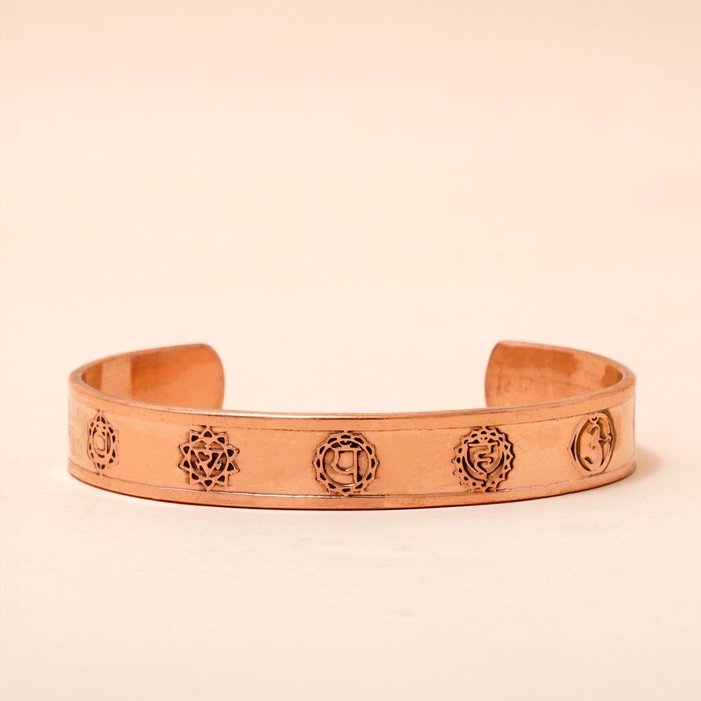 Chakra copper cuff. Crafted of pure copper with the mantras of the seven chakras engraved across its length