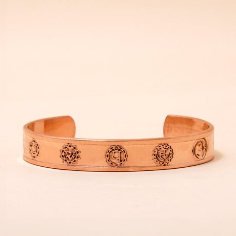 Chakra copper cuff. Crafted of pure copper with the mantras of the seven chakras engraved across its length