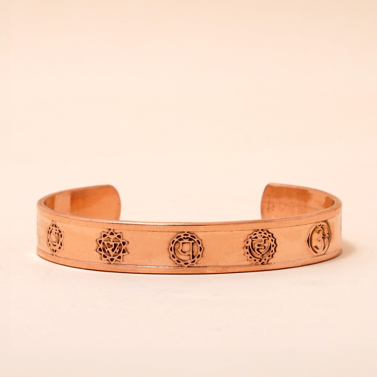 Chakra copper cuff. Crafted of pure copper with the mantras of the seven chakras engraved across its length