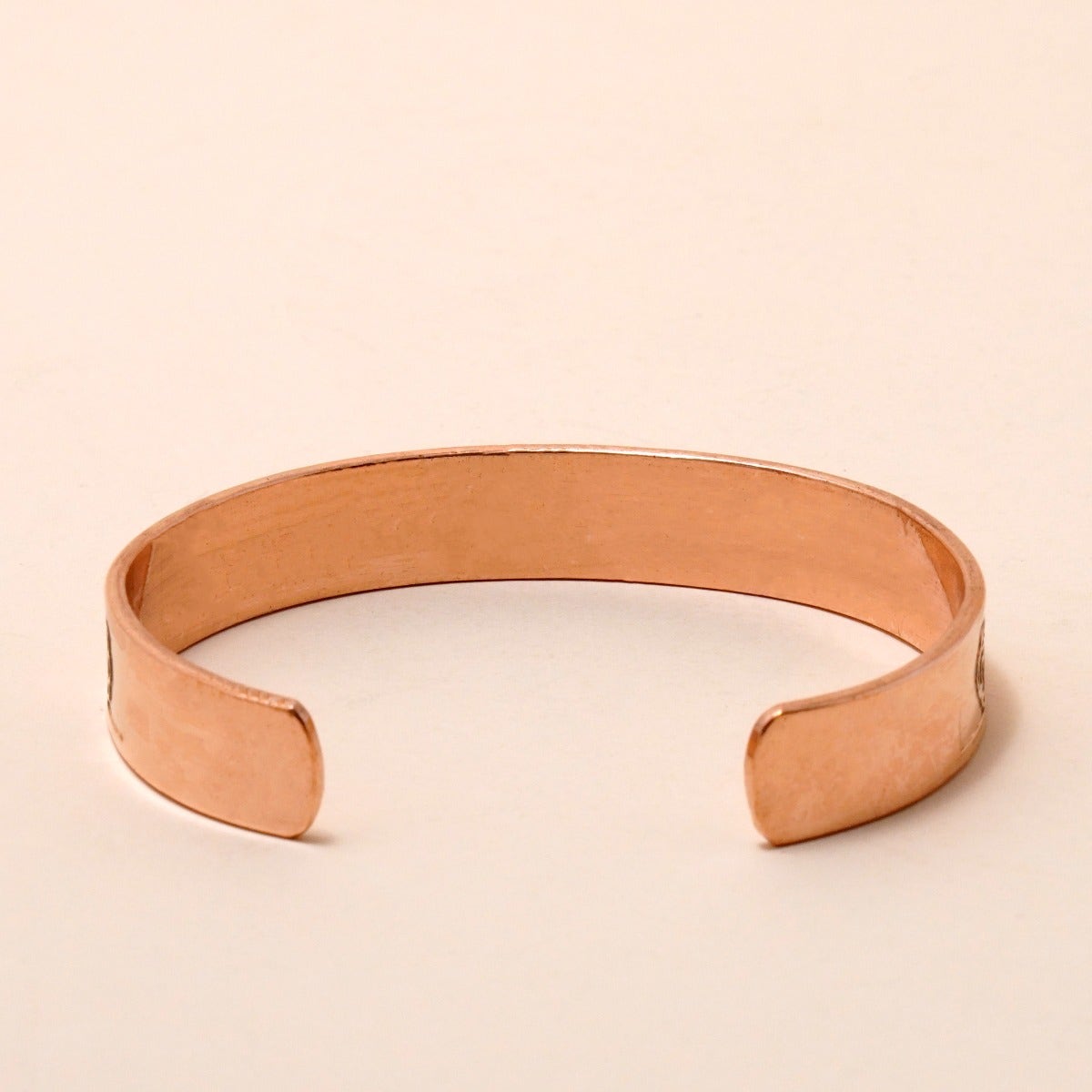 Chakra copper cuff. Crafted of pure copper with the mantras of the seven chakras engraved across its length