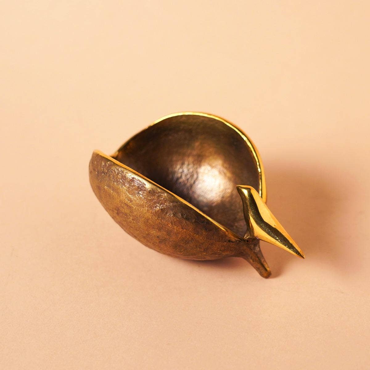 Bird on pod - brass decorative