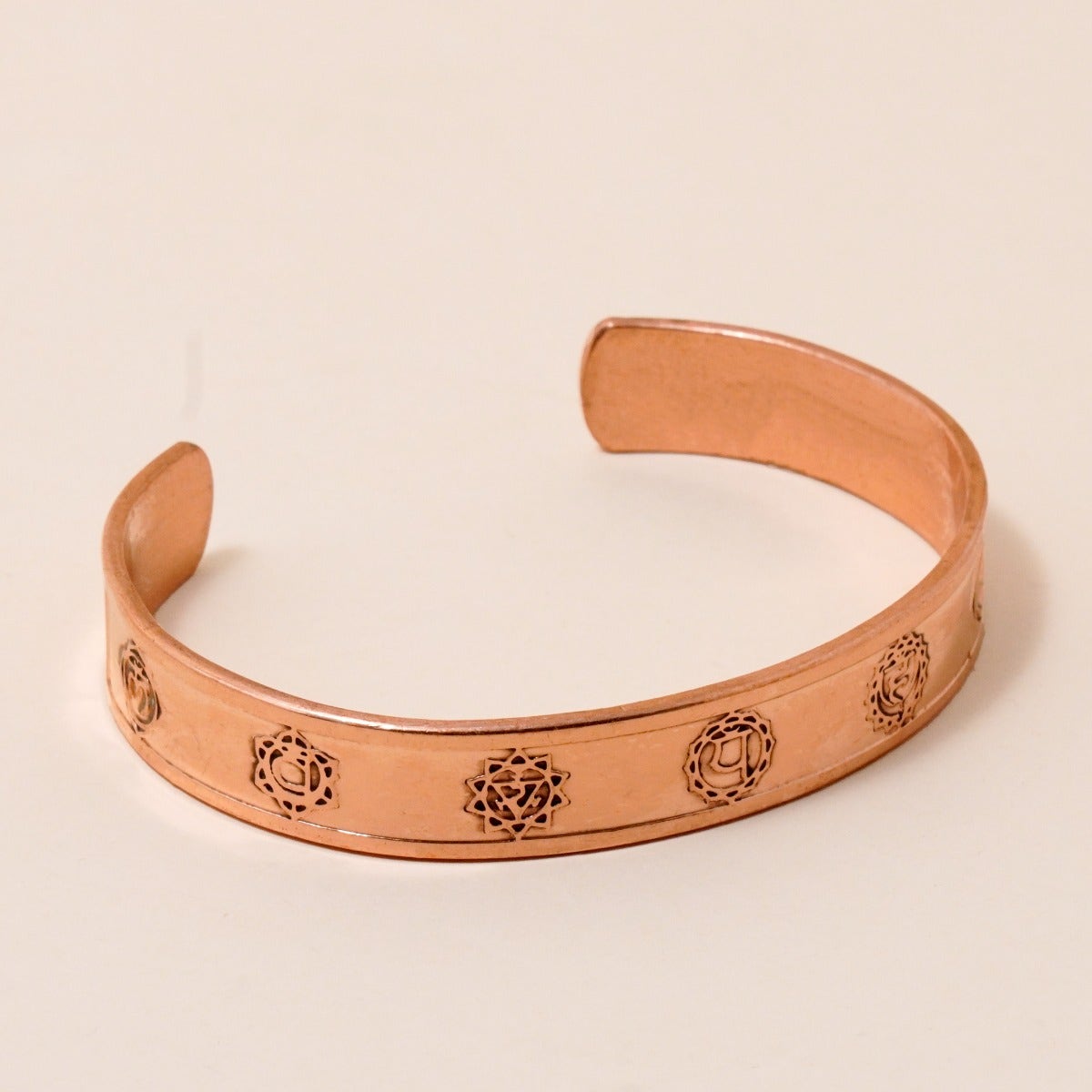 Chakra copper cuff. Crafted of pure copper with the mantras of the seven chakras engraved across its length