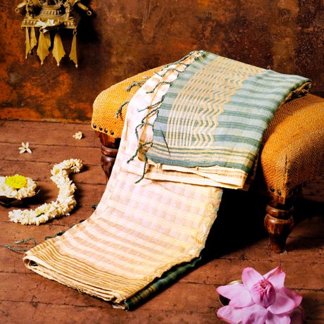 Cream and Pastel Green Silk Energized Saree with rich golden zari work