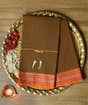 Brown Devi Consecrated Cotton Saree with Red Border