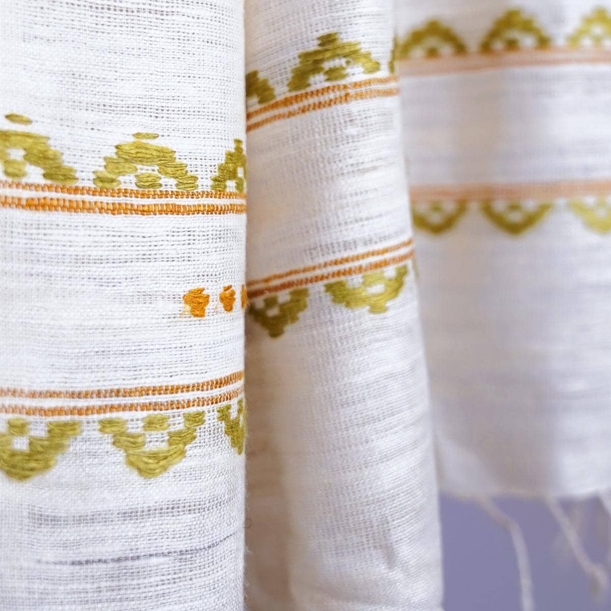 Naturally dyed handwoven white eri silk stole with traditional design