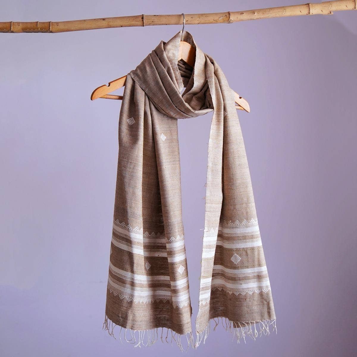 Graceful grey eri silk stole, naturally dyed with tea and henna, featuring traditional and contemporary white designs
