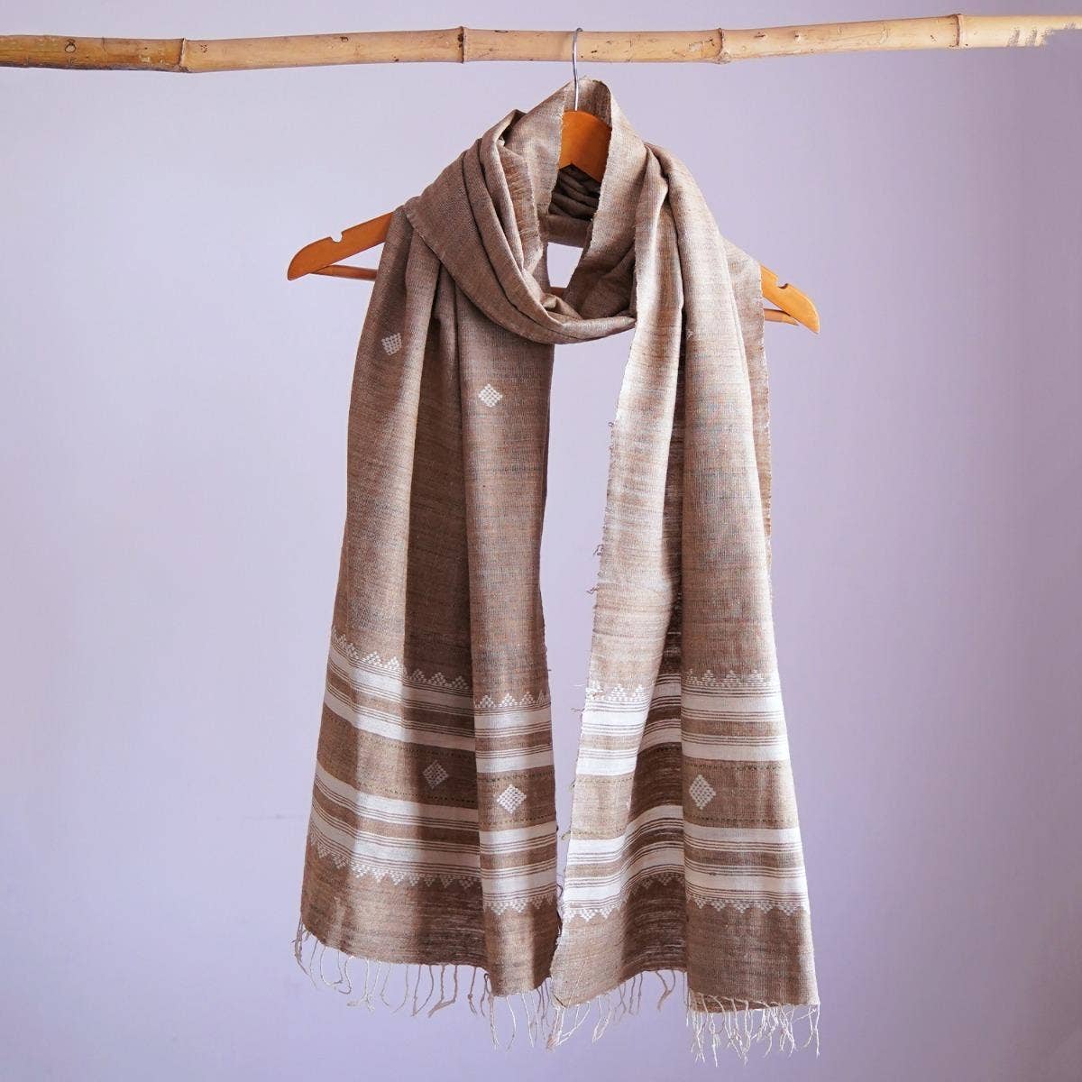 Graceful grey eri silk stole, naturally dyed with tea and henna, featuring traditional and contemporary white designs
