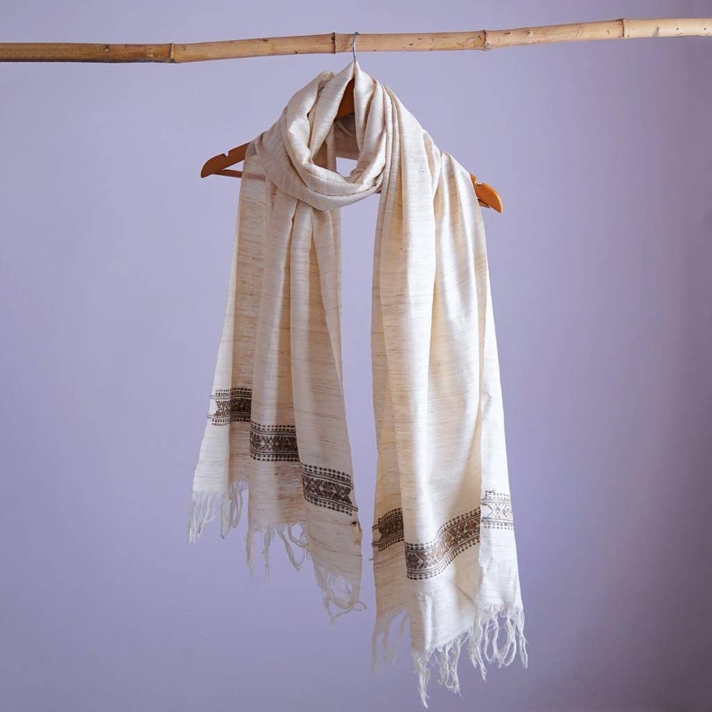 Chic off-white eri silk stole, naturally dyed with tea leaves, showcasing an intricately designed traditional pattern band