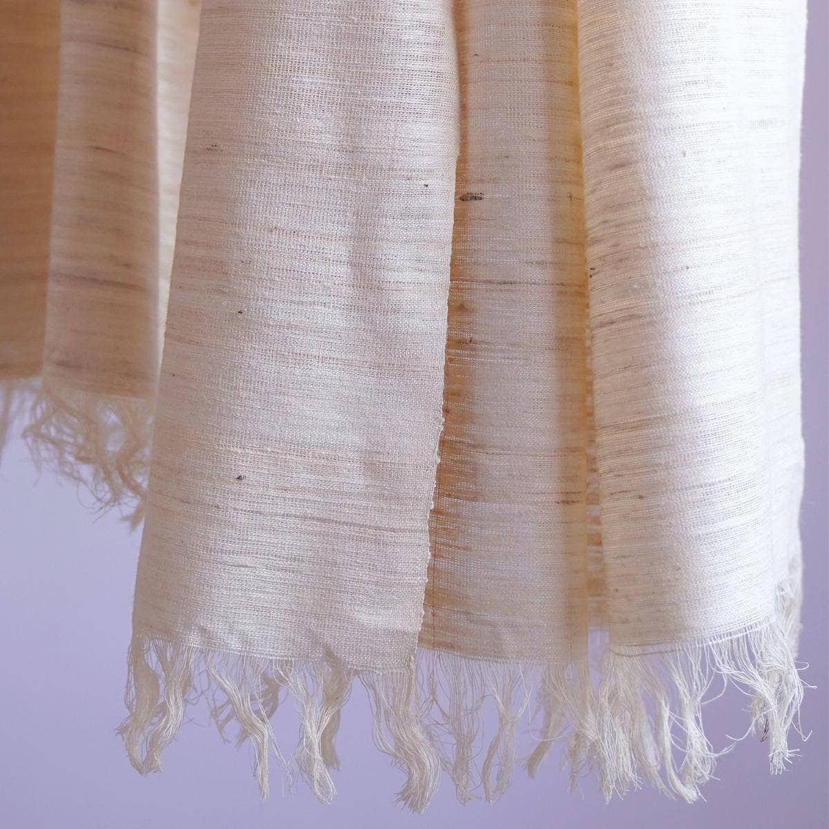 Handwoven classy off-white eri silk stole with an edgy finish