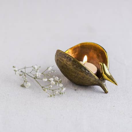 Bird on pod - brass decorative