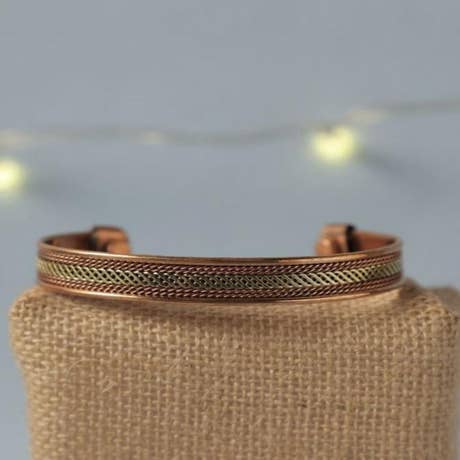 Two-tone copper cuff. Adjustable copper cuff featuring a copper/brass finish combination.